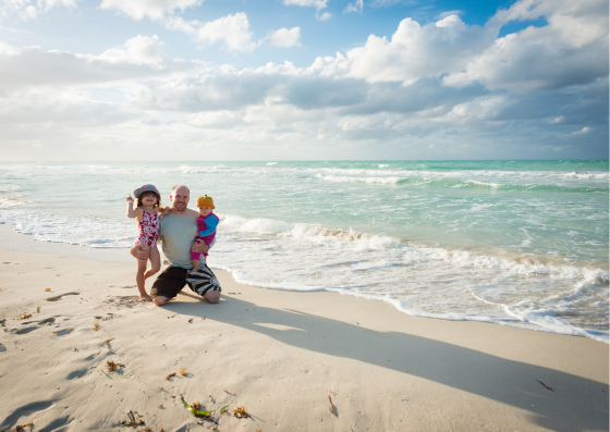 Dad on the beach with kids